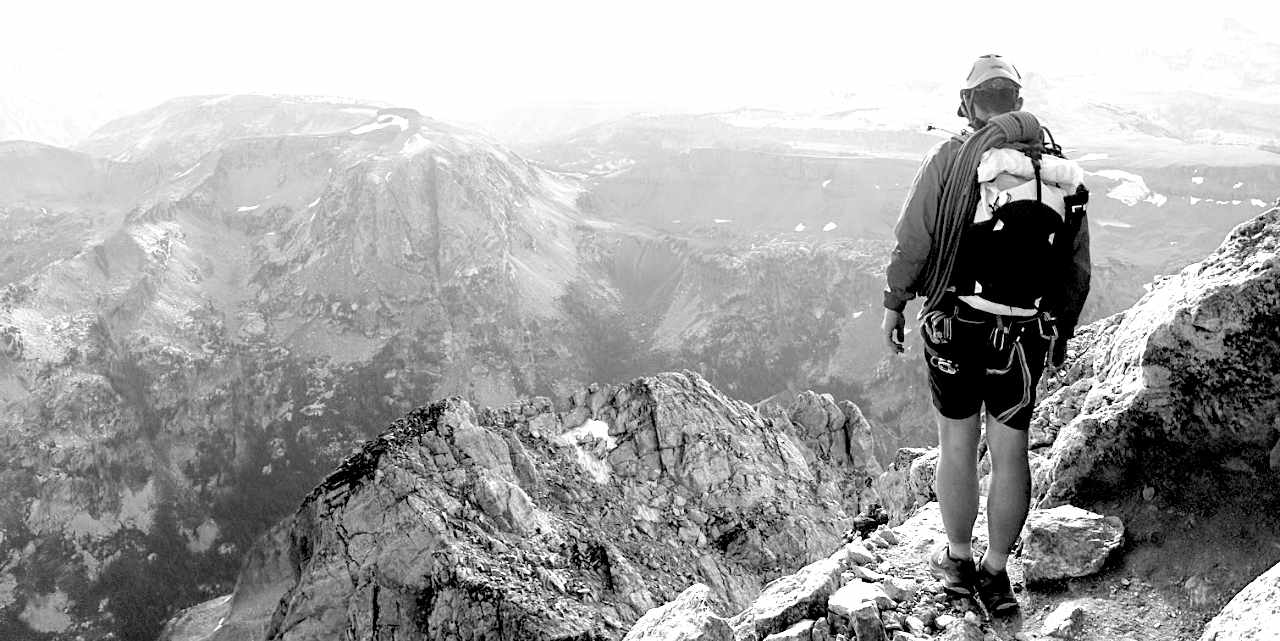 Photo of a person on a mountain wearing the Altruist race vest.